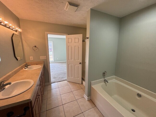 Building Photo - Keys to Happiness – Unlock Your New Home.