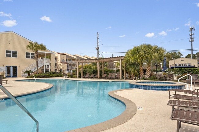 Building Photo - Welcome to Coastal Living at Harbor Landing Condominiums!