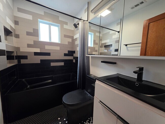 Building Photo - Charming 2BR with Walk-Out Basement, Fenced Yard & Flexible Murphy-Bed Office