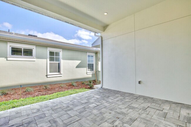Building Photo - Gorgeous 4/3 Residence with a Private Back Lanai and a 2 Car Garage in the Delightful Laureate Pa...