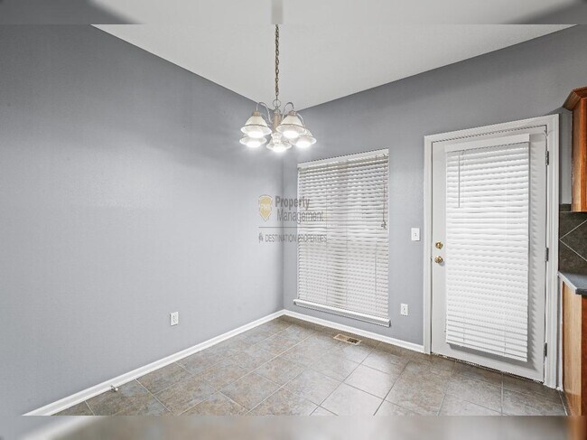 Building Photo - "Charming Lenexa Townhouse: Spacious 2-Bed Retreat with Finished Basement & Gleaming Hardwood Flo...