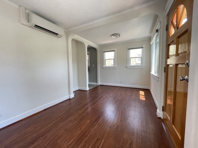 Living room facing north with access to kitchen - 3534 Helms Ave