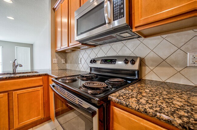 Building Photo - Beautiful 3/3 w/ 2 Car Garage in Gated Vil...
