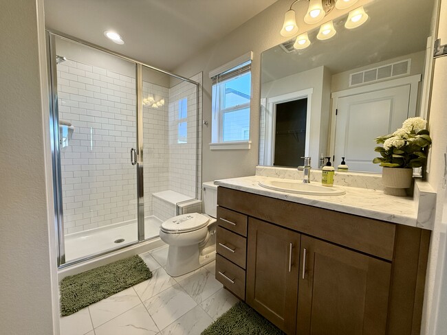 Stylish Bathroom: Features sleek fixtures, ample storage, and a clean, contemporary design. - 6125 Lantana Light Vw