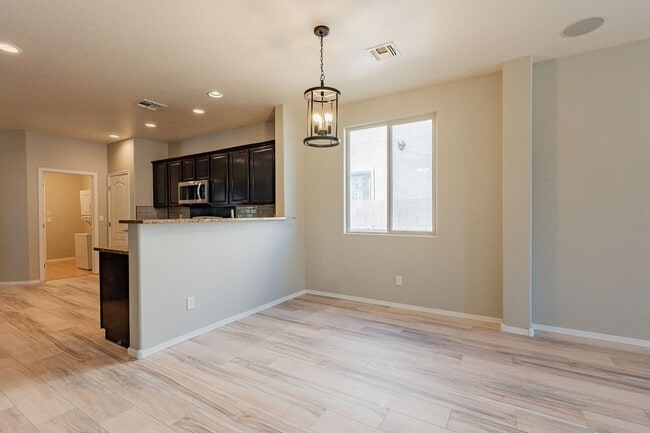 Building Photo - Four Bedrooms, 3 Car Garage - New flooring!