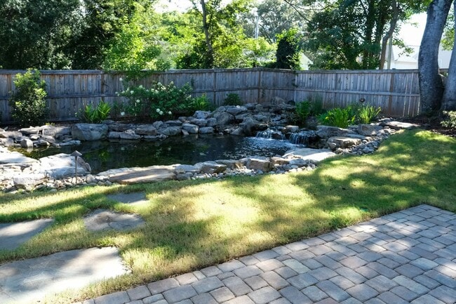 Building Photo - Like-new 3 bedroom, 2.5 bath house with an organic pond!