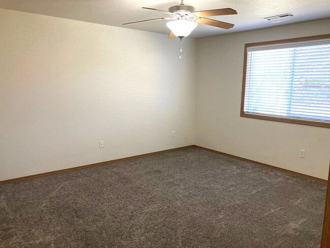 Building Photo - this ranch-style home features 4 bedrooms and 2 bathrooms.