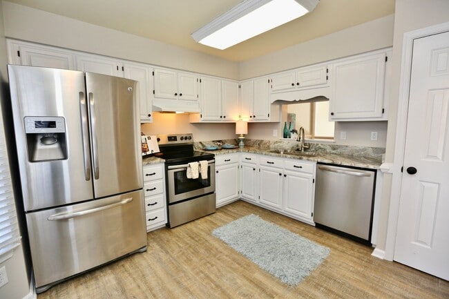 Building Photo - Updated End-Unit Brick Townhome Ready NOW!...