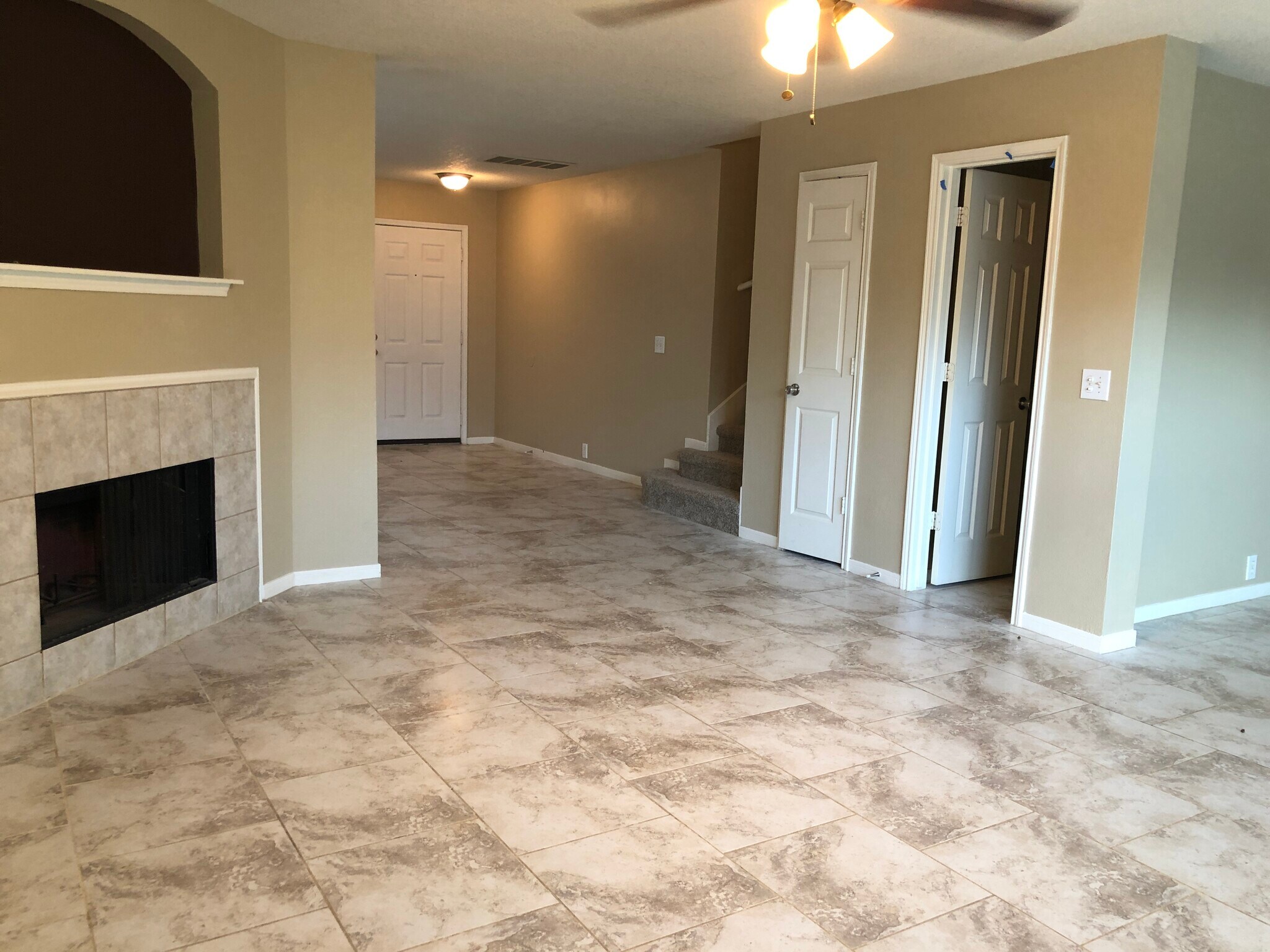 A view of the half-bathroom and coat closet from the family room. - 17359 Turquoise Stream Dr