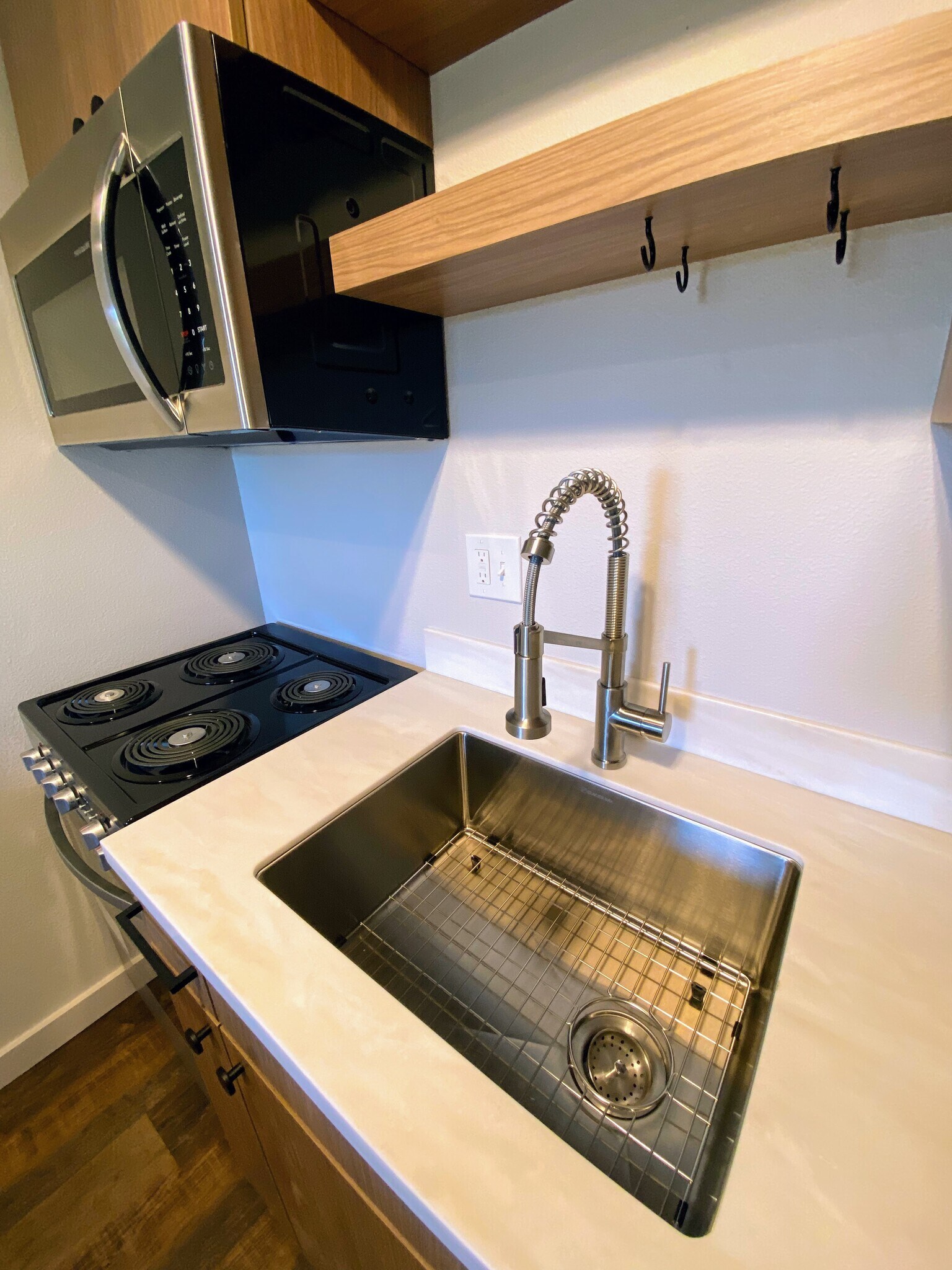 Modern stainless steel appliances and deep basin sink for easy cooking and cleanup. - 575 Greenwood Ave