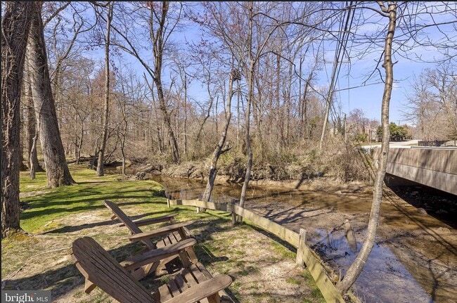 Creek with chairs on property - 5500 Old Mill Rd