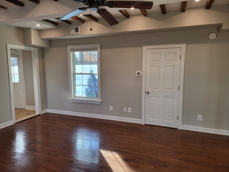 Living room facing bathroom and yard - 731 N Stokes St
