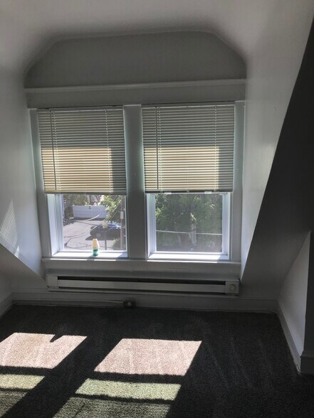 Four windows in main room - 104 Gayley St