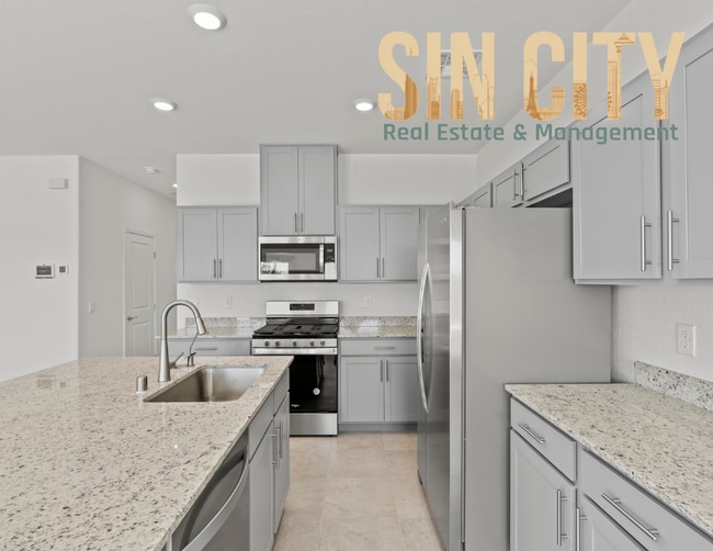 Building Photo - "Charming 4-Bed Home on Love Springs Ln: Spacious 1865 Sq Ft with 2.5 Baths in North Las Vegas!"