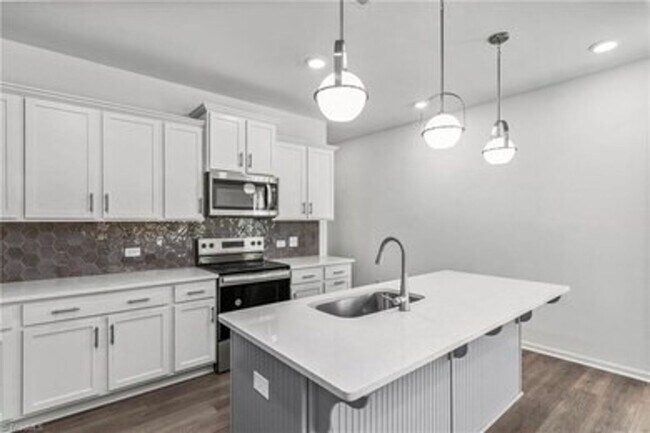 Building Photo - Spacious 3-Bedroom Townhome with Private Patio, Central HVAC & In-Unit Laundry Hookups