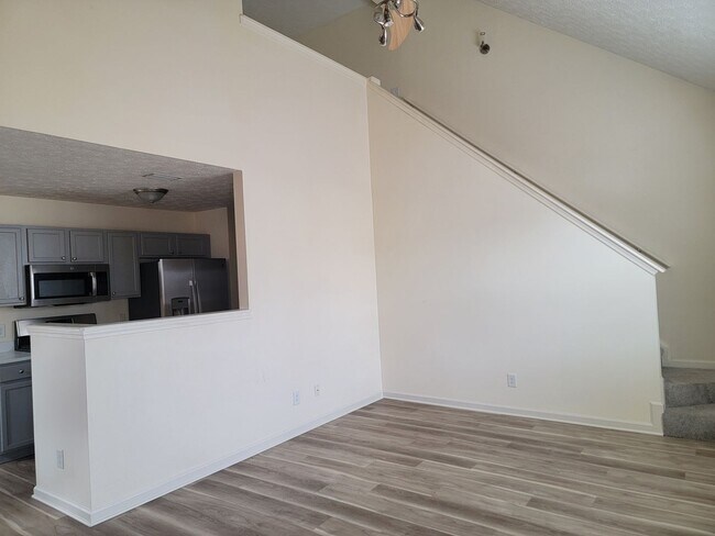 Building Photo - Lake Front Property. Loft - Swim/Tennis - Stainless Steel Appliances