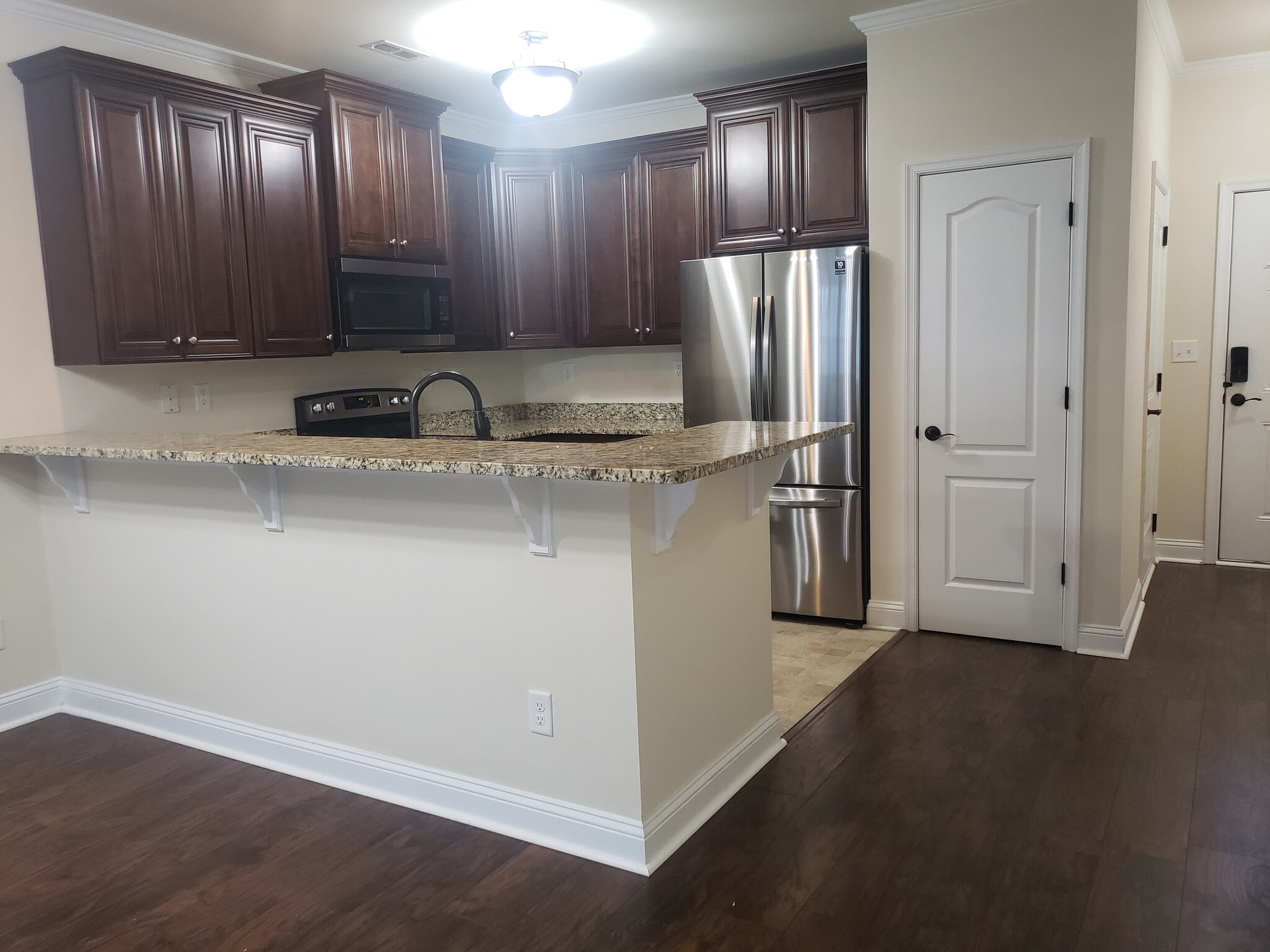View from Family Room into Kitchen - 216 Astra Ln