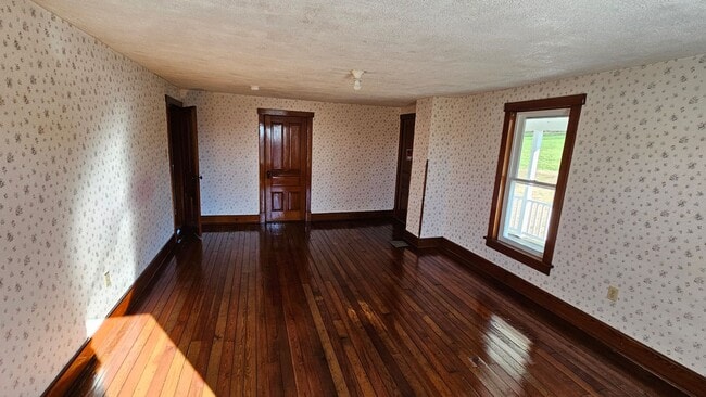 Building Photo - Country Living in This 4 Bedroom Farmhouse!