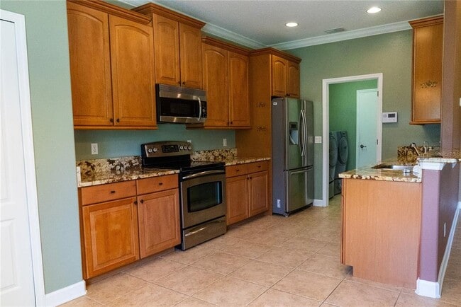 Building Photo - 5144 Legacy Oaks Dr