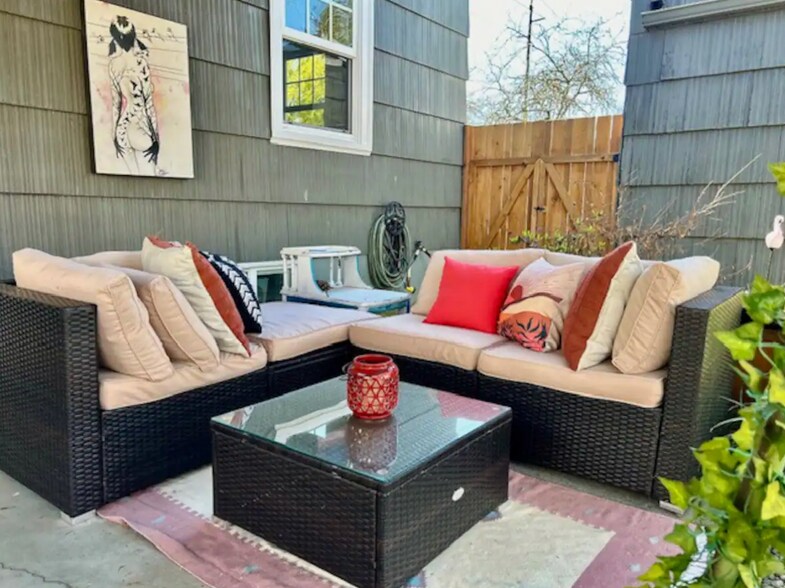 Outdoor seating area for lounging or dining in backyard. - 4115 SE Gladstone St