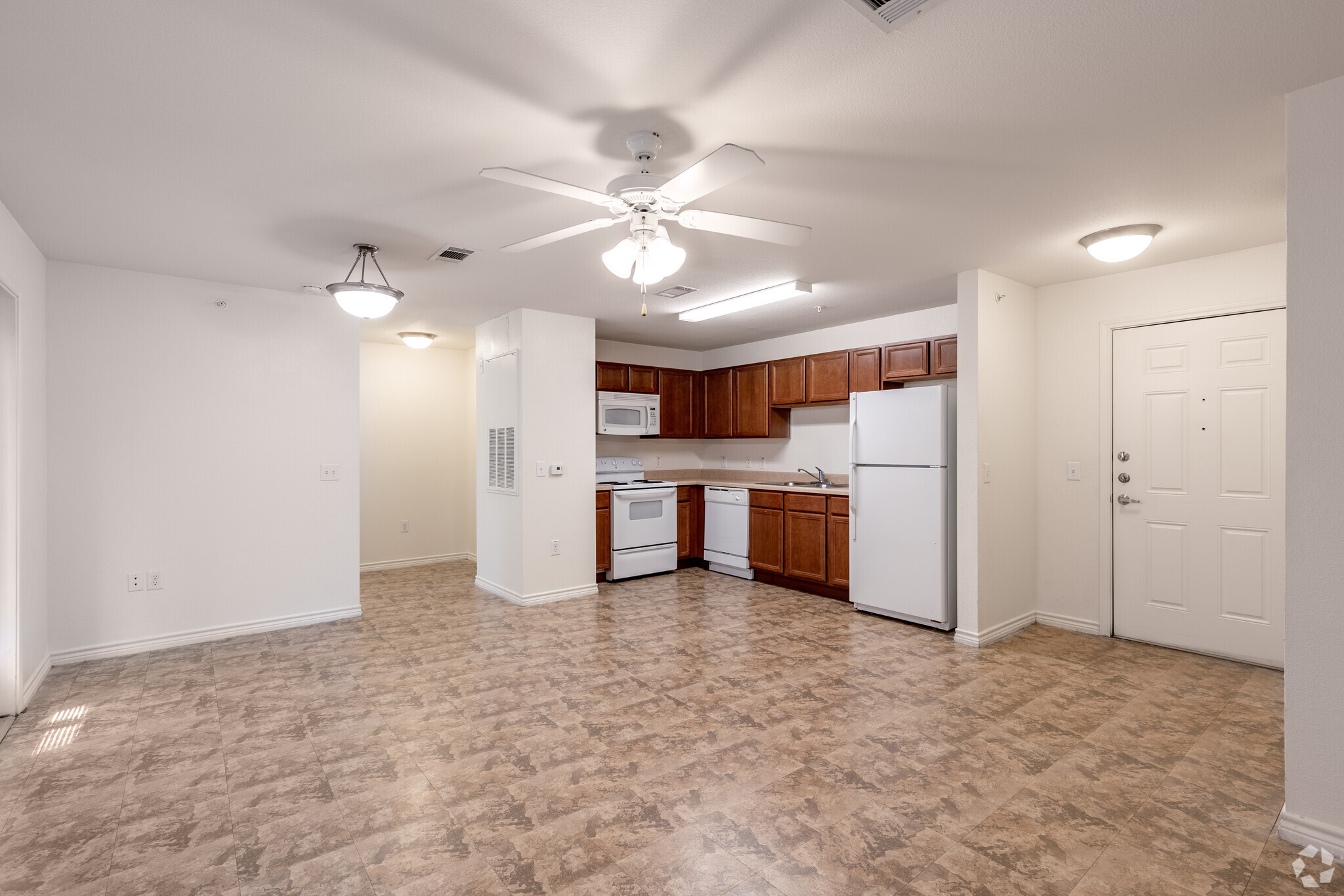 1BR, 1BA - 650SF - Living Room and Kitchen - The Mirabella Senior Apartments