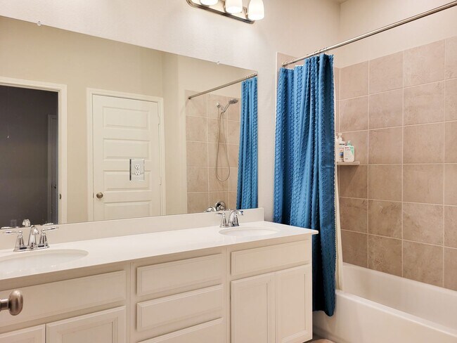 Building Photo - A true gem on a quiet corner lot, this spacious and sun-filled home is tucked away from street no...