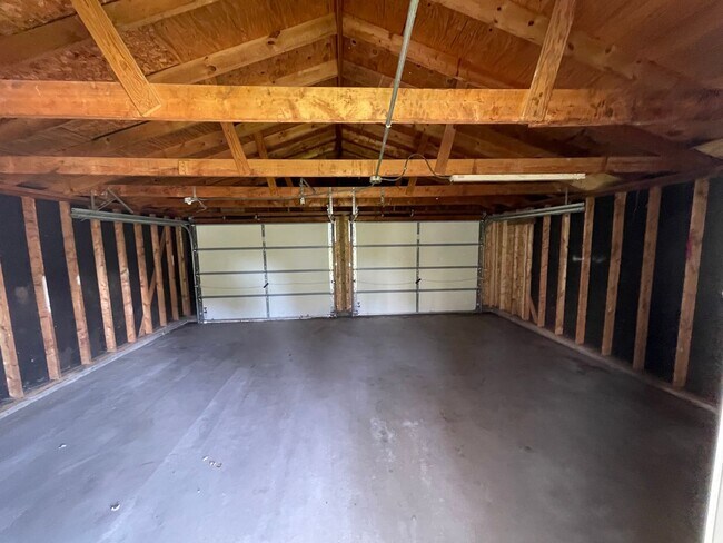 Building Photo - Interested in a two-bedroom house that includes a large garage. Please let us know
