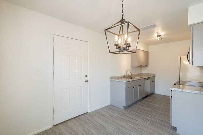 Building Photo - Updated home with large backyard & 2 car g...