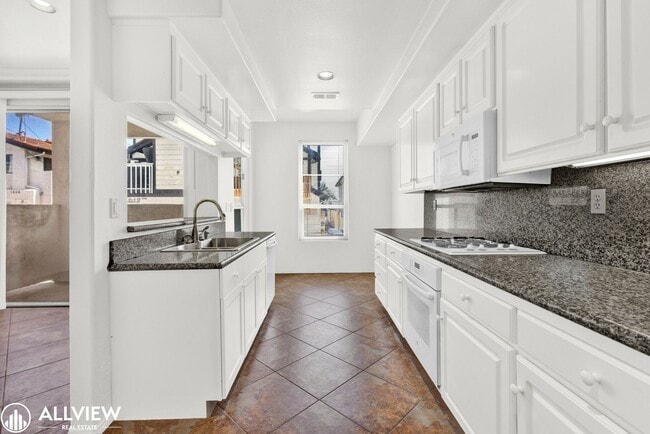 Building Photo - Spacious Coastal Condo with Rooftop Ocean ...