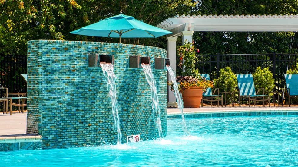 Fountains accent the swimming pool - North Shore Gardens