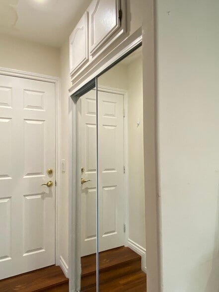 Mirrored closet with above storage - 611 S Griffith Park Dr