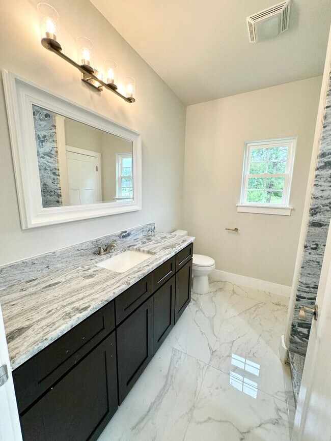 Building Photo - LOOK AT THIS ONE! BEAUTIFUL home with a pond view right outside the back patio!