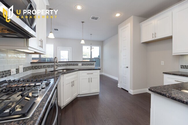 Building Photo - Luxury Townhome- wood flooring. Great location