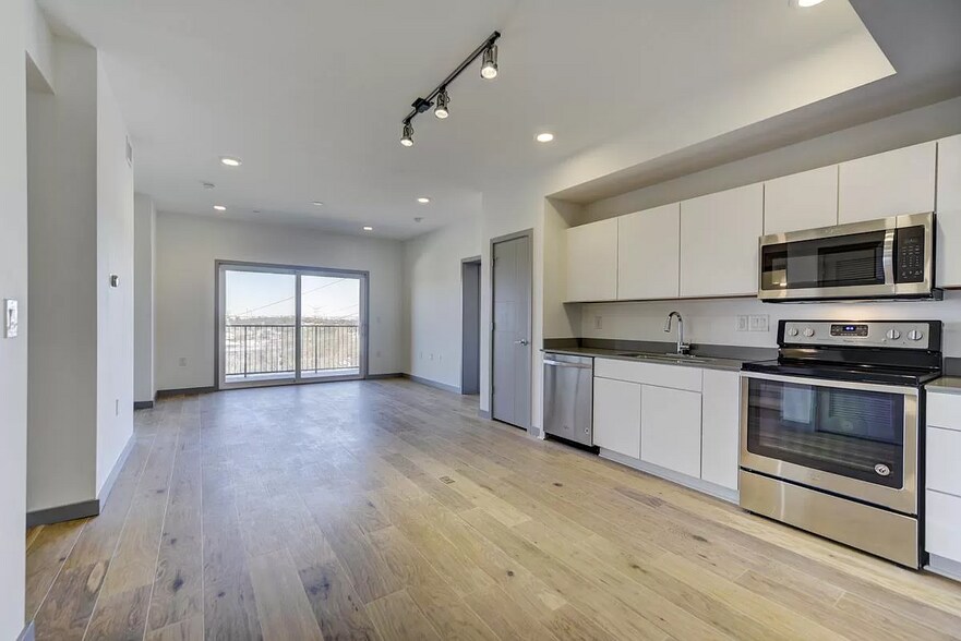 living room with balcony from the entrance - 400 Herron Dr