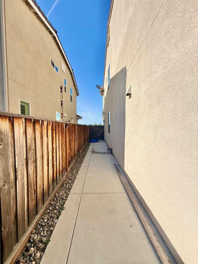 Building Photo - Spacious 5-Bedroom Home | Private Yard + Attached Garage