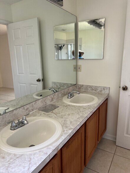 Sunk in shower with The master bath features a relaxing garden tub and dual sinks — perfect - 5374 Lacy Jane Way