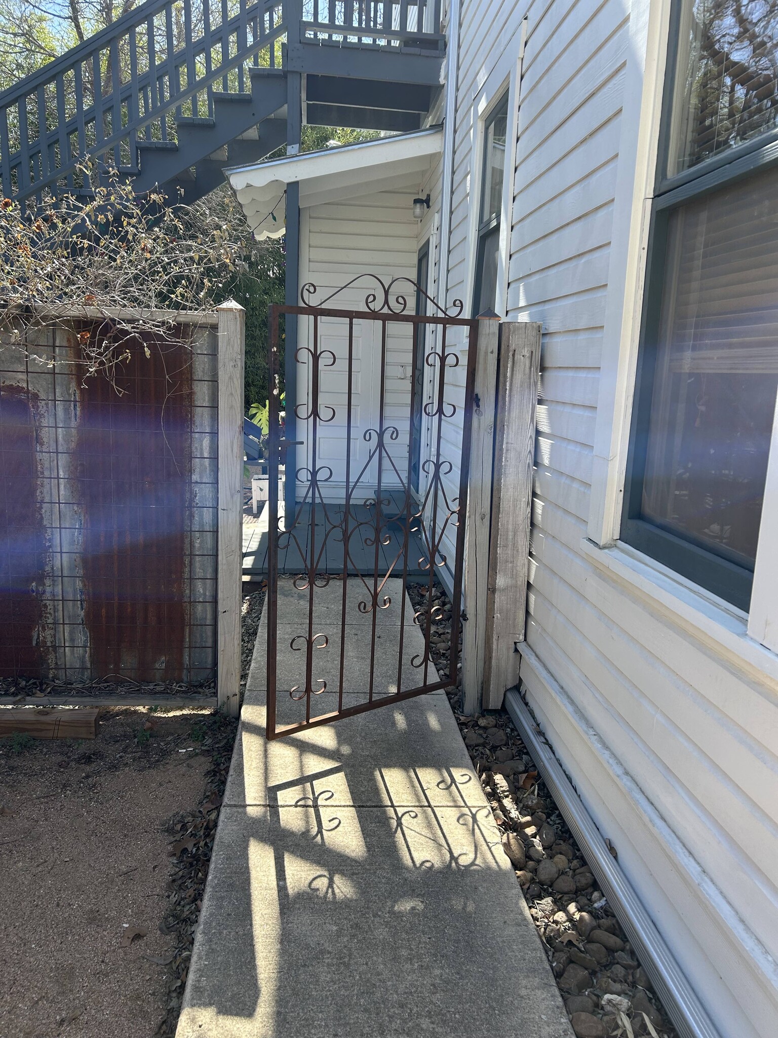 Gate to Apt 1 entry porch - 704 E Guenther St
