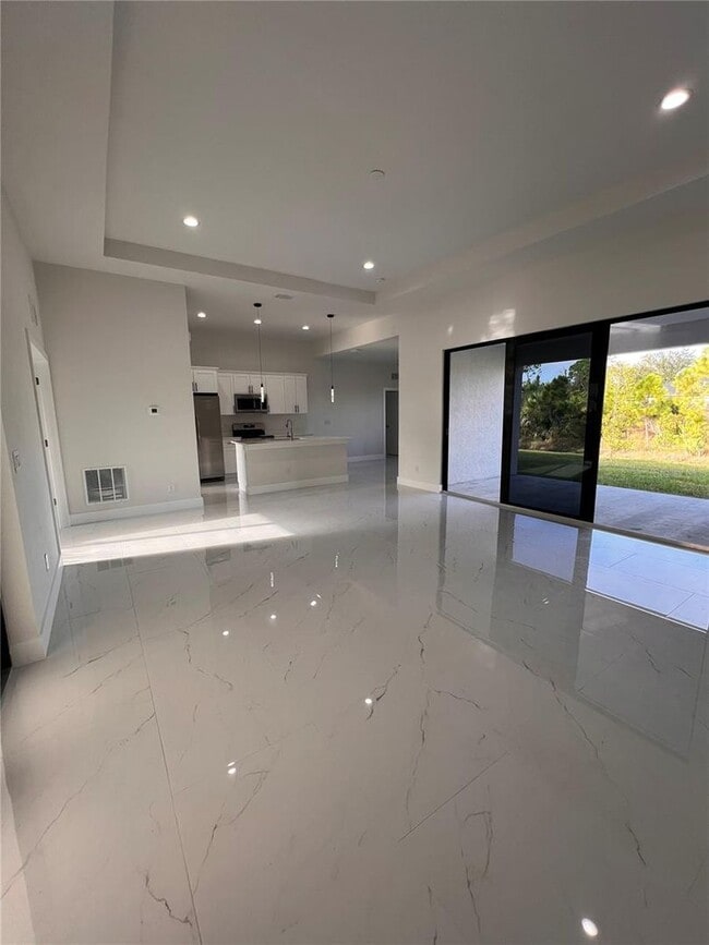 Building Photo - Be the first in occupy this 2025 constructed home in the vibrant city of Port Charlotte, FL! Qual...