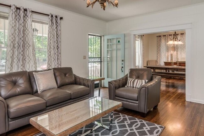 Building Photo - Welcome home to this stunning FULLY FURNISHED and AMPLE FREE PARKING for at least six cars!