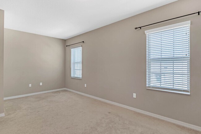 Building Photo - Spacious, Nearly New and Gated 3/2.5/2 Plu...