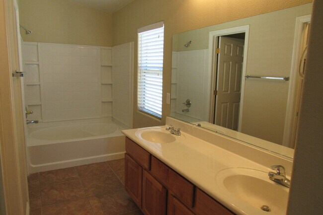 Building Photo - AMAZING 2 STORY TOWNHOME LOCATED IN A GATE...
