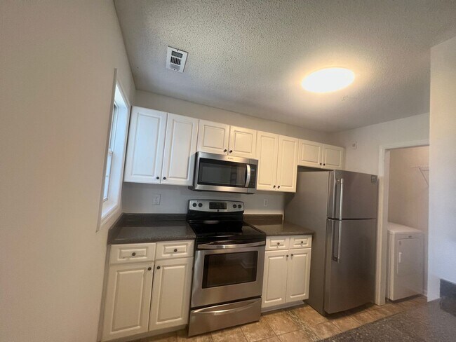 Building Photo - RENT SPECIAL! Freshly Painted! New Luxury ...