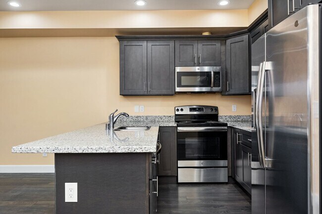 Building Photo - Sophisticated One-Bedroom Living at Marigold Apartments — Available Now