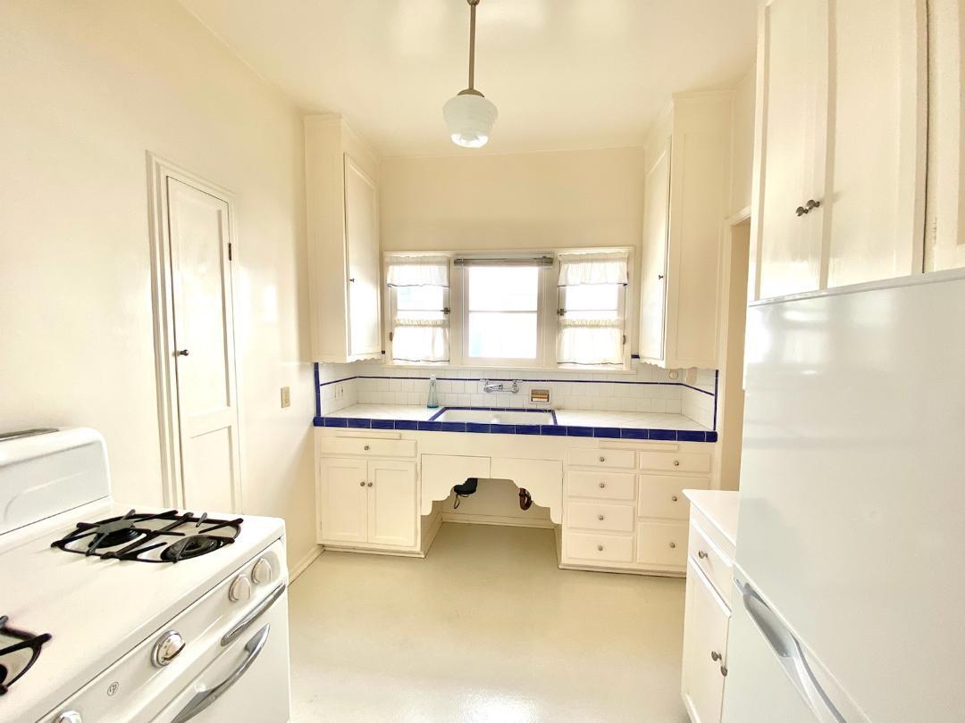Kitchen with Range and Refrigerator - 1835 Kelton Ave