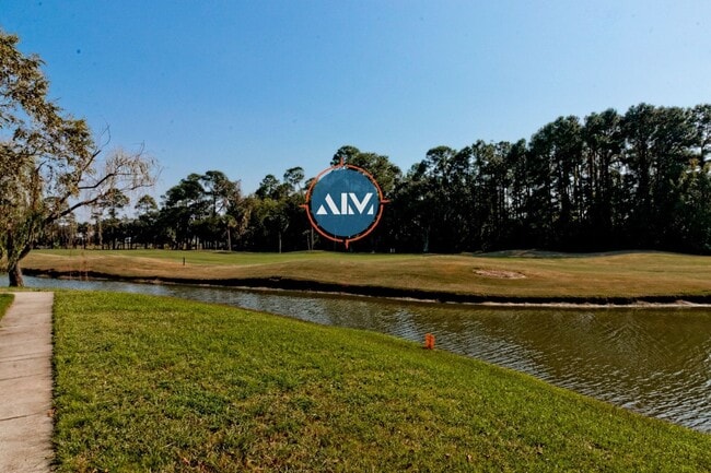 Building Photo - Charming First-Floor Condo with Pond Views at The Estate at Westbury