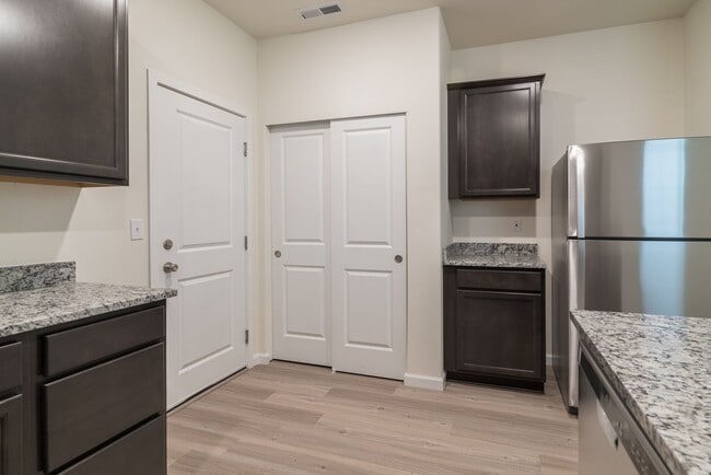 Building Photo - Super clean & spacious 4-bdrm/3-bath townhome in NE—Attached garage, great location