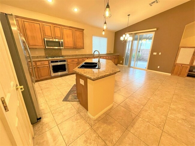 Building Photo - Vaulted Ceiling single-story home in a gat...