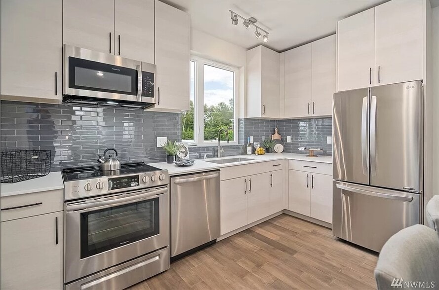 Kitchen, Stainless steel appliances and quartz countertops - 9268 50th Ave S