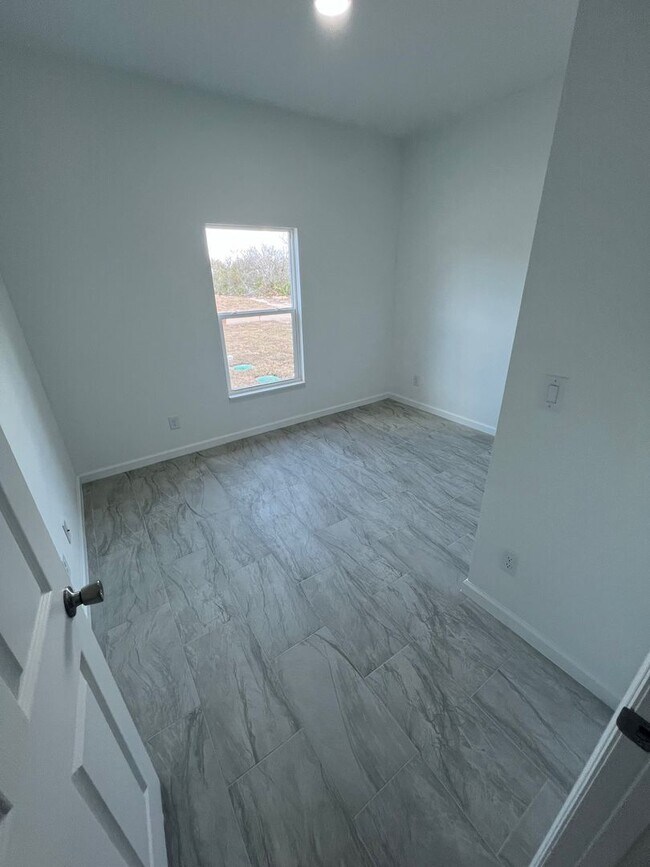 Building Photo - Brand-New 3BR/2BA Home with Garage – Serene Lake Placid Neighborhood