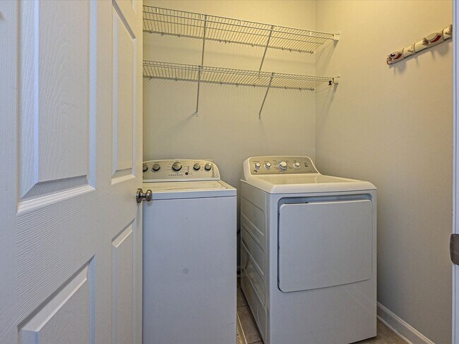 Building Photo - Stylish Condo Living with Open Concept, Garage & Outdoor Space